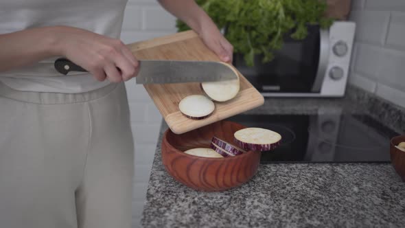 Sliced Nubia Eggplant Transferred In Wooden Bowl