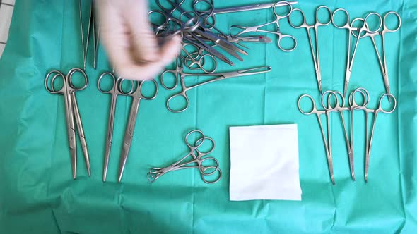 Multiple Surgery Instruments on Blue Table Above View