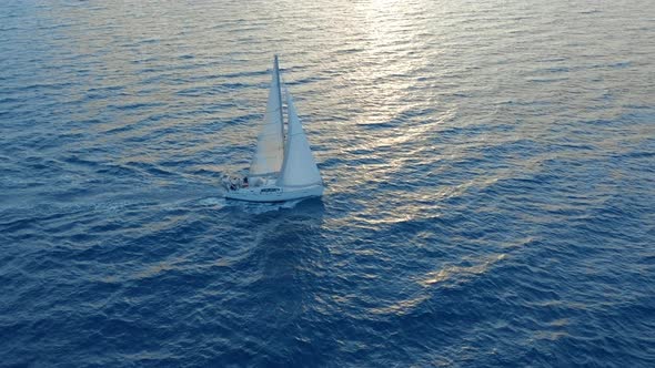 Aerial View Yacht Sailing on Opened Sea. Sailing Boat Yacht From Above. Yachting at Windy Day