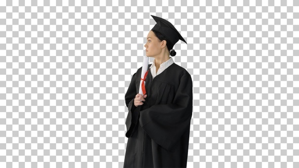 Female student in graduation robe holding, Alpha Channel