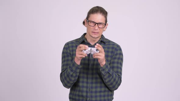 Stressed Hipster Man Playing Games and Losing