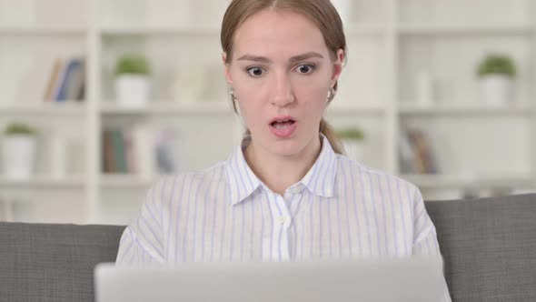 Portrait of Disappointed Young Woman Having Loss on Laptop
