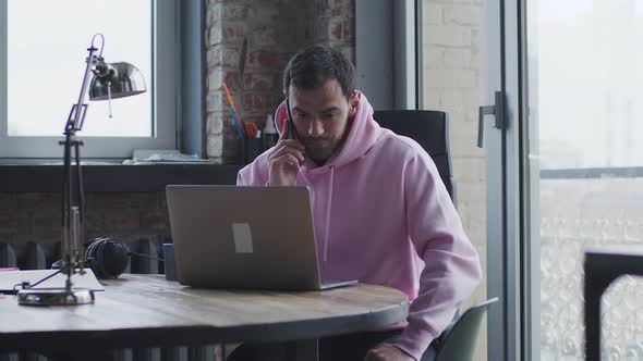 A Young Handsome Man Works in the Office