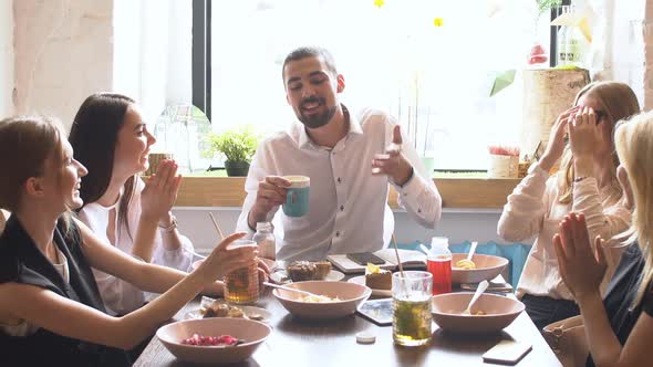 Multiracial Friends Having Fun at Meeting in Coffeehouse, Diverse Buddies Join Hands Up Together