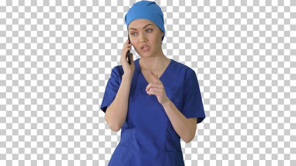 Serious female doctor talking on the phone, Alpha Channel