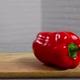 Bell pepper falls on a bamboo cutting board - VideoHive Item for Sale