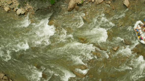 Aerial View of People Rafting on Mountain River