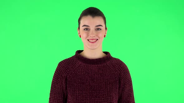 Young Woman Smiling Revealing Teeth. Green Screen