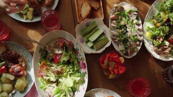 Dining Table with Various Salads Top View