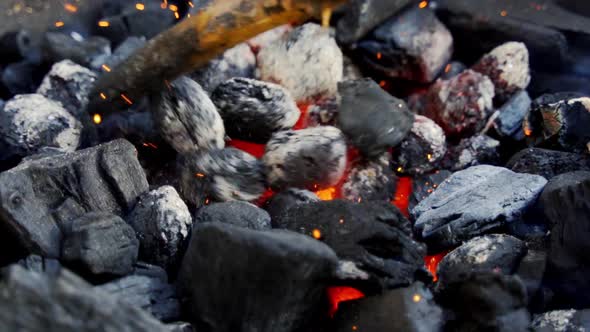 Closeup of Glowing Coal in Metal Grill on Summer Day in Slow Motion