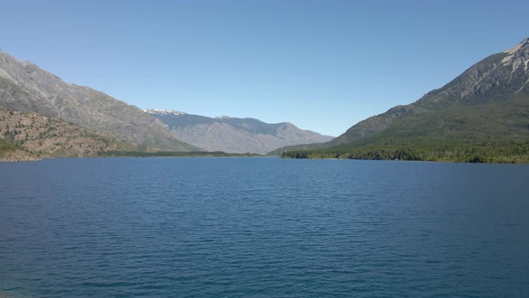 Aerial dolly in of Epuyen lake surrounded by Andean mountains, Patagonia Argentina