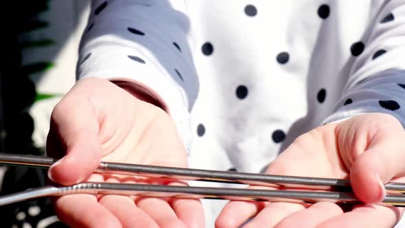 Slow Motion Woman Holding Reusable Metal Straw