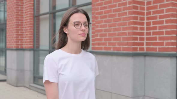 Close up of Young Woman Walking on Street, Side View