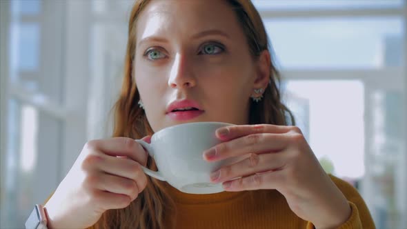 Portrait Close Up of Happy Pretty Young Woman, Girl Sitting in a Cafe, Drinking Morning Coffee in