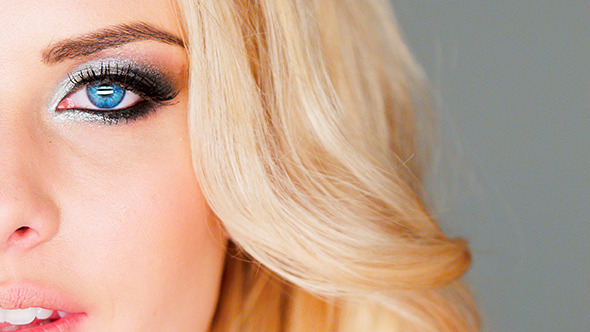 Blue Eye And Makeup Of a Beautiful Blond Woman