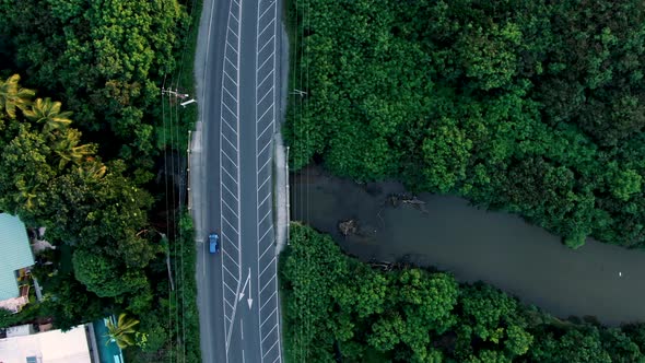 Birds eye view of bridge with ongoing traffic in small Caribbean island of Saint Lucia.