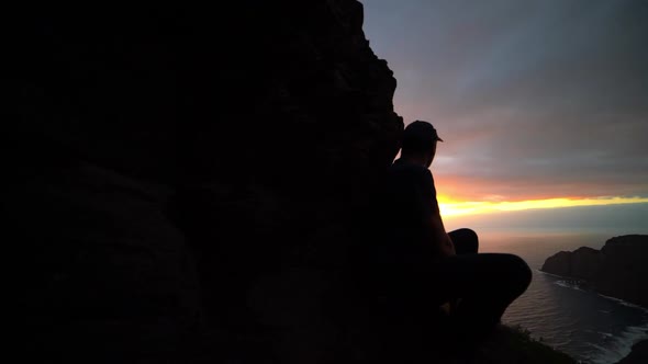 Man Watching Sunrise From Mountains