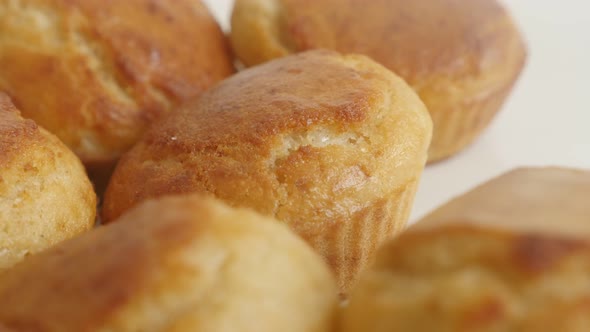 Panning over  cornmeal on white plate 4K 2160p 30fps UltraHD footage - Golden color cornbread shaped