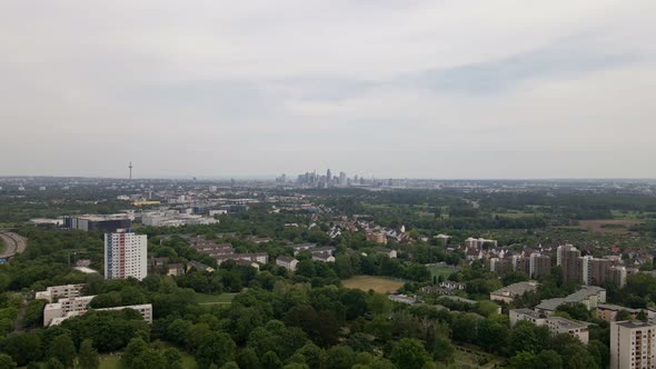 Aerial footage of the cityscape of Frankfurt am Main on a cloudy spring day. Fast wide angle pull ba