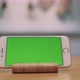 Mobile Phone with Green Screen Is Standing on the Table - VideoHive Item for Sale