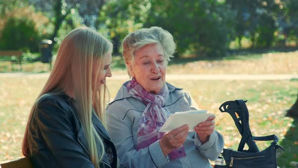 Old Woman Showing Her Pretty Granddaughter a Letter