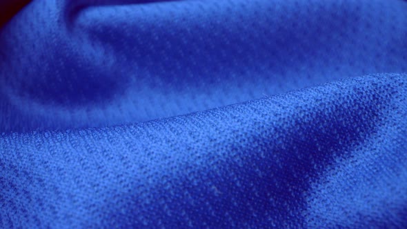 Close up detailed cloth texture of shiny spandex cloth with dolly shot.