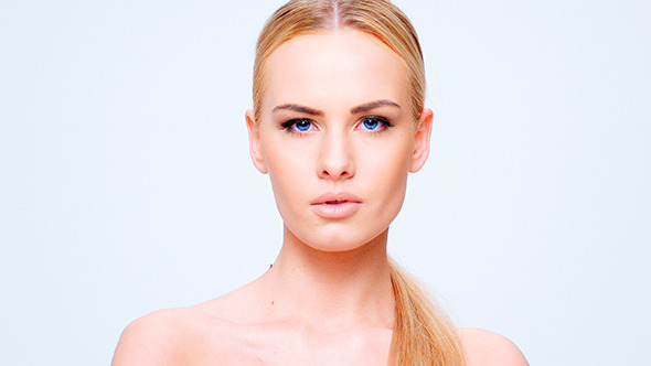 Young Beautiful Blond Girl Posing Isolated on Whit alt