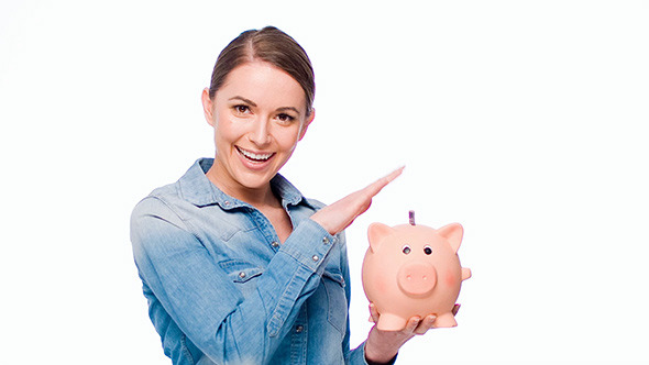 Young Casual Dressed Woman Put Banknote Into Piggy