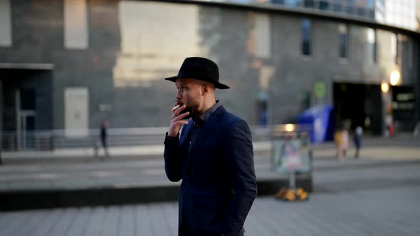 Funny Shot with Stylish Man and Hat Blowed Away By Wind Person is Walking in City