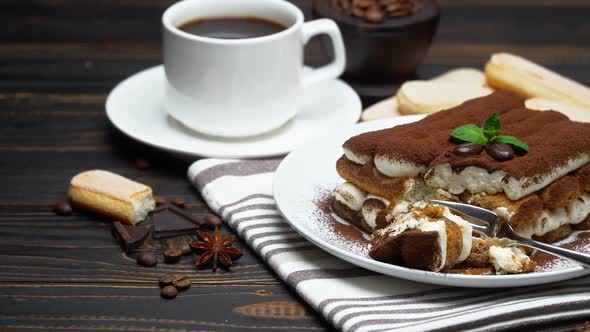 Portion of Classic Tiramisu Dessert and Savoiardi Cookies on Wooden Background