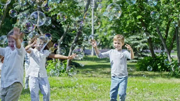 Laughing Kids Catching Soap Bubbles alt