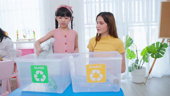 Asian beautiful young woman teacher teaching a lesson to kid at school.