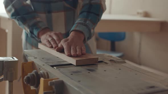 Unrecognizable Carpenter Using Wood Router