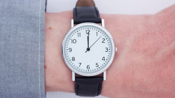 Close up of a man wearing a wrist watch