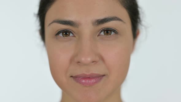 Close Up of Indian Woman Opening Eyes, White Background