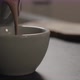 Slow Motion Closeup Pour Cocoa Drink Into White Cup on Concrete Countertop with Copy Space - VideoHive Item for Sale