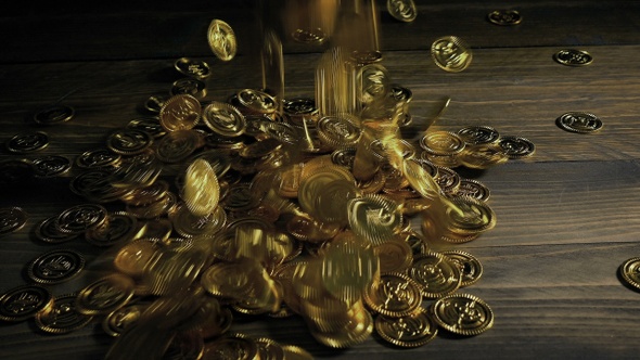Gold Coins Fall On Table