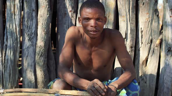 Koisan man with bow and arrow, Chomipapa, Angola