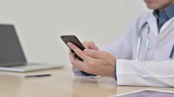 Hands of Doctor Using Smartphone Close Up 