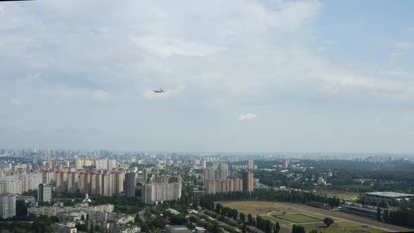 Big plane flies over the city. An-225 Mria