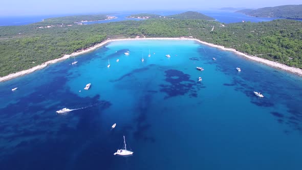 Flying over yachts and sailing boats at a Dalmatian bay