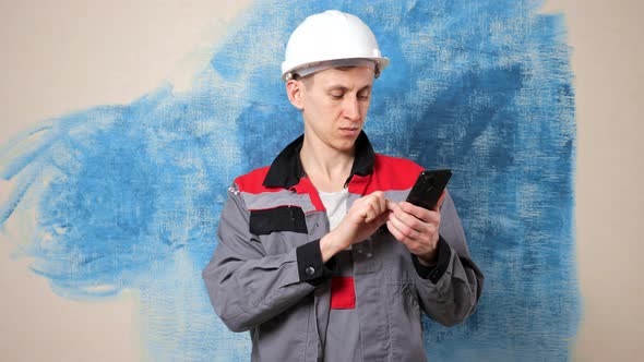 Concentrated Worker Looks for Repair Material Via Internet