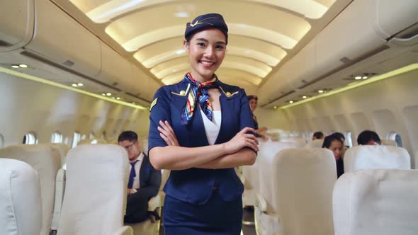 Cabin Crew or Air Hostess Working in Airplane