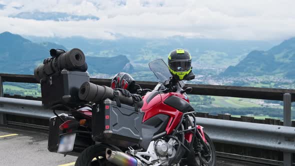 Motorbike with Luggage Bags Stands By Mountain Landscape of Alps Liechtenstein