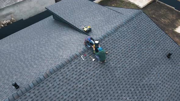 Construction Workers Installing Chimney and Building Construction Concept