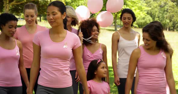 Women Going on a Walk for Breast Cancer Awareness in the Park