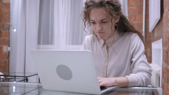 Frustrated Angry Female Working on Laptop in Office