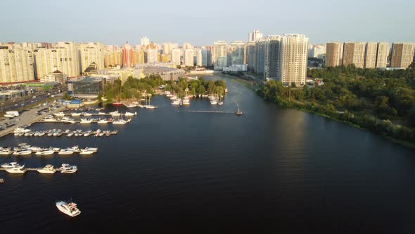 Aerial view of the modern sailboat sailing on the river