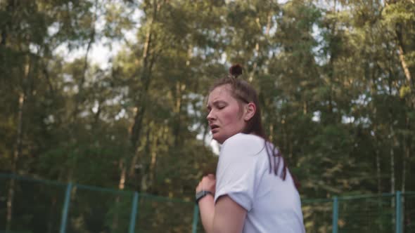 Woman in the Park on the Playground is Engaged in Active Cardio Workout