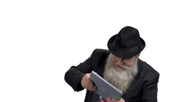 Old Excited Man Playing Game on Digital Tablet